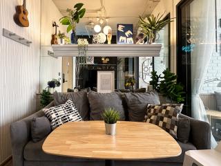 Cozy living room with modern furniture and decorative plants