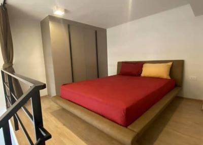 Cozy bedroom with minimalist design and warm lighting