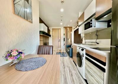 Modern kitchen with dining area in a bright apartment