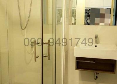 Modern bathroom interior with glass shower stall