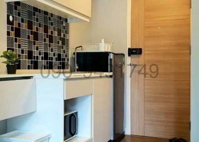 Modern kitchen with stainless steel appliances and wooden floor