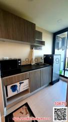 Modern compact kitchen with wooden finish and appliances
