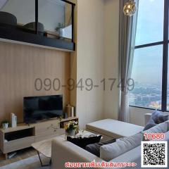 Modern living room with city view through large windows