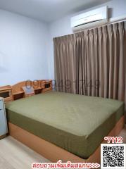 Modern furnished bedroom with air conditioning unit