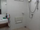 Clean and well-maintained bathroom with white tiles