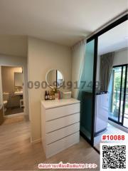 Bright bedroom with sliding door access to balcony and built-in storage