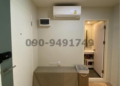 Cozy bedroom with modern air conditioning unit