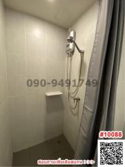 Modern tiled bathroom with shower and curtain