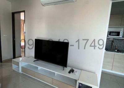 Modern living room interior with wall-mounted TV and air conditioning unit