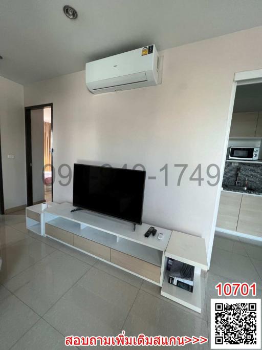 Modern living room interior with wall-mounted TV and air conditioning unit