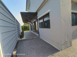 Modern home exterior with pathway and side entrance