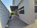 Modern home exterior with pathway and side entrance