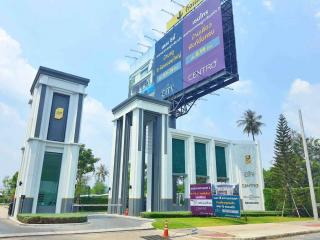 Modern commercial building entrance with advertising billboard