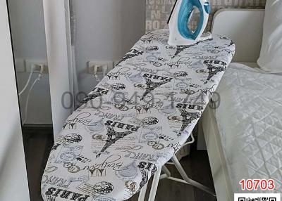 Ironing board and iron in a modern bedroom setting