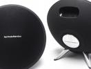 Two harman/kardon speakers on a white background