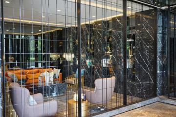 Luxurious lobby area with modern furnishings and marble details