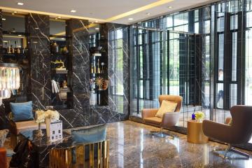 Luxurious lobby area with marble floors and designer furniture