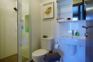 Modern bathroom with shower cabin and vanity