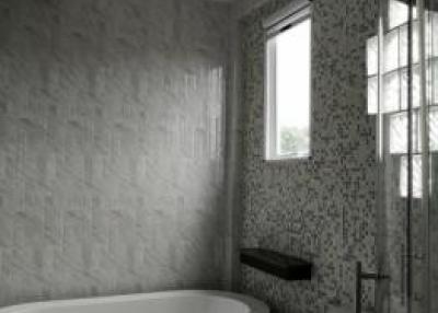 Modern bathroom with floral wallpaper and natural light