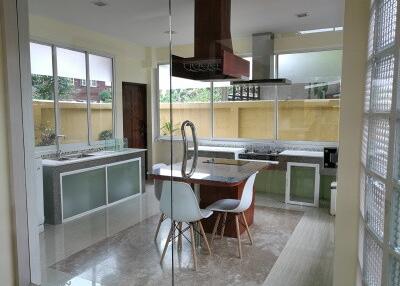 Modern kitchen with natural light and dining area