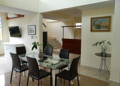 Modern living room with dining area and staircase
