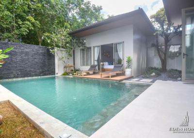 Private pool with adjoining patio in a modern home setting