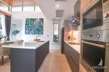 Modern kitchen with stainless steel appliances and central island