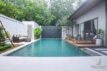 Private pool with adjoining patio in a serene backyard setting