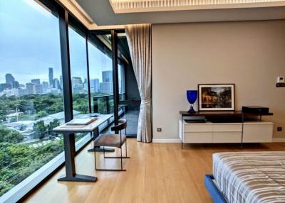 Modern bedroom with city view and ample natural light