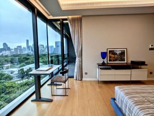 Modern bedroom with city view and ample natural light