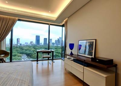 Modern bedroom with city view and ample natural light