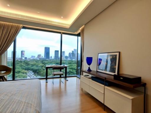 Modern bedroom with city view and ample natural light