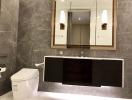 Modern bathroom with marble tiles and sleek fixtures