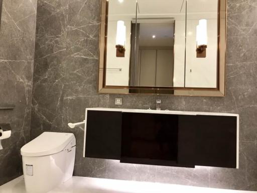 Modern bathroom with marble tiles and sleek fixtures