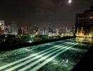 Luxurious rooftop pool with city skyline view at night