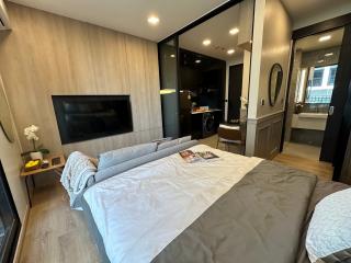 Modern bedroom with ensuite kitchen and sleek design
