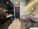 Modern kitchen with dark cabinetry and stylish decor