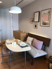 Cozy dining area with modern furniture and artwork