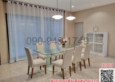 Elegant dining room with glass table and comfortable chairs