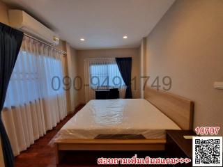 Cozy bedroom with large bed and natural light