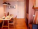 Cozy dining room area with natural wood furniture and warm lighting