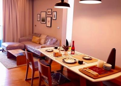 Cozy living room with dining area and open view to balcony