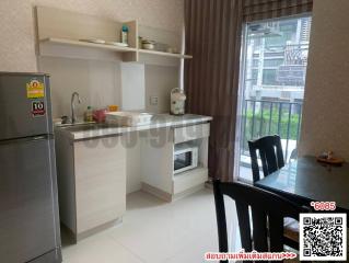 Spacious and modern kitchen with natural lighting and appliances