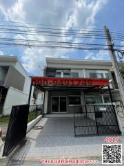 Modern two-story building exterior under blue sky