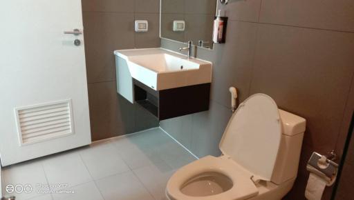 Modern bathroom with wall-mounted sink and toilet