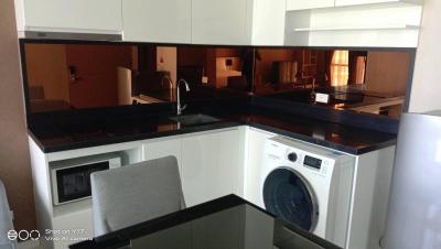 Modern kitchen with bar-style counter and appliances