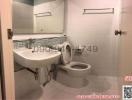 Compact bathroom with toilet and washbasin