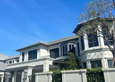 Elegant two-story house with a clear blue sky