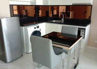 Modern kitchen with dining area and appliances