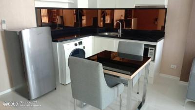 Modern kitchen with dining area and appliances